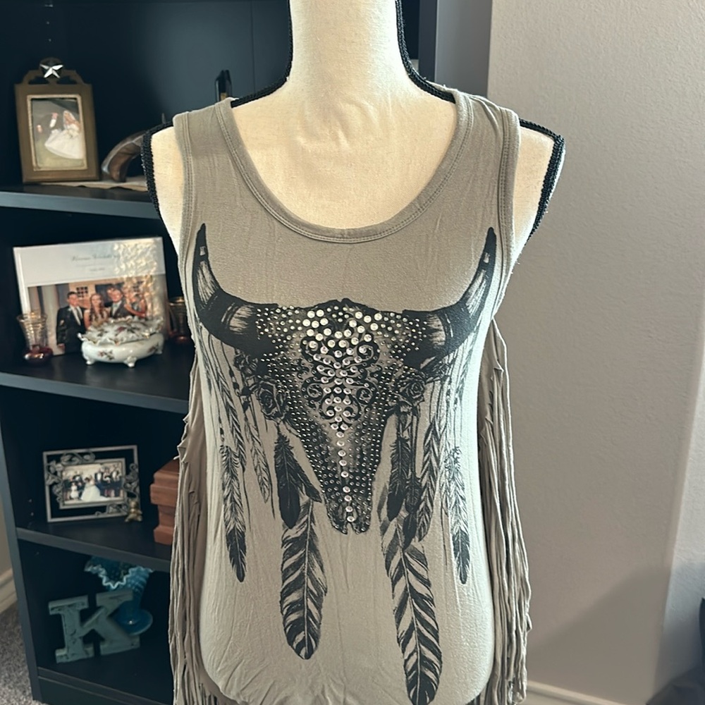 Olive green, stretchy material with fringe sides